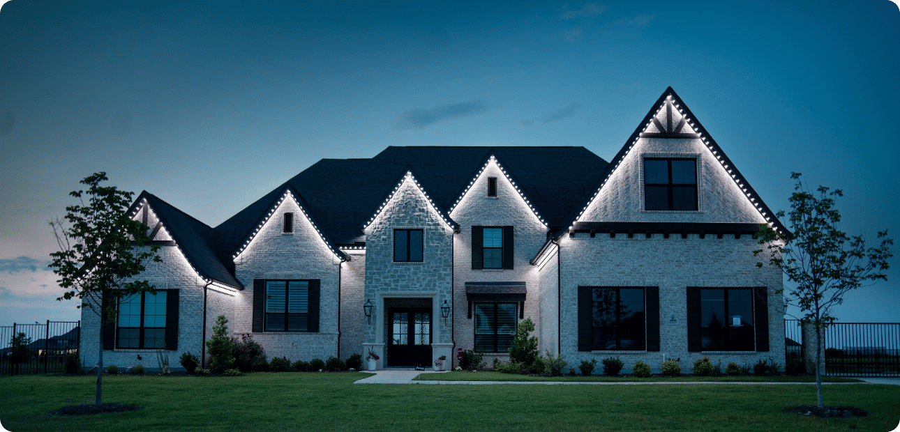 Home lit with bright white security lighting at night